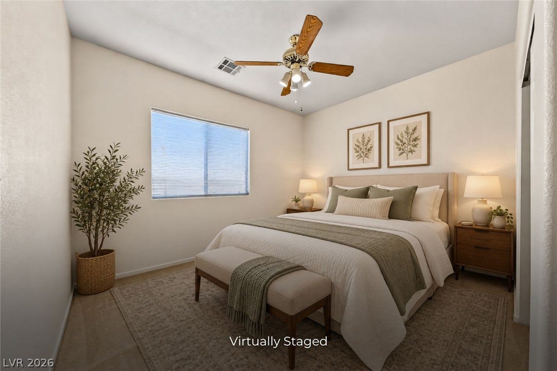 2906 Pumpkin Harvest Avenue, North Las Vegas, NV 89031 Crisp neutral walls and soft carpeting create a tranquil atmosphere in this serene bedroom.