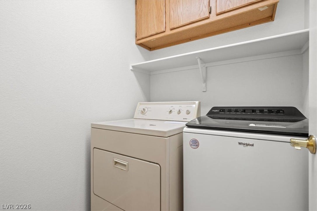 3535 Barrel Bronco Court, North Las Vegas, NV 89032 Functional overhead storage cabinets and open shelving maximize space in this utility area.
