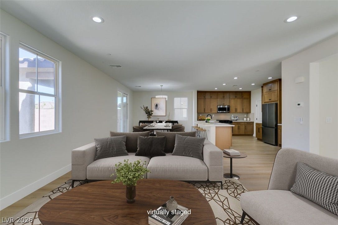 197 Sicily Hills Court, Henderson, NV 89012 An open floorplan seamlessly connects the living area to a modern kitchen and dining space.