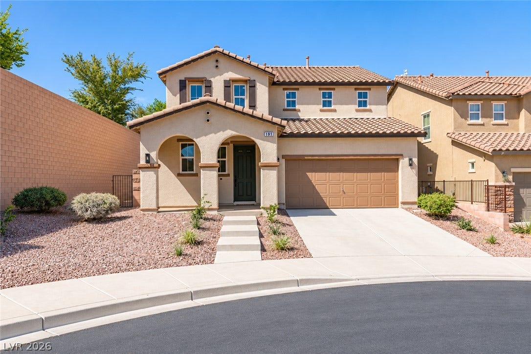 197 Sicily Hills Court, Henderson, NV 89012 Inviting arches and a classic tile roof define this elegant two-story stucco home.