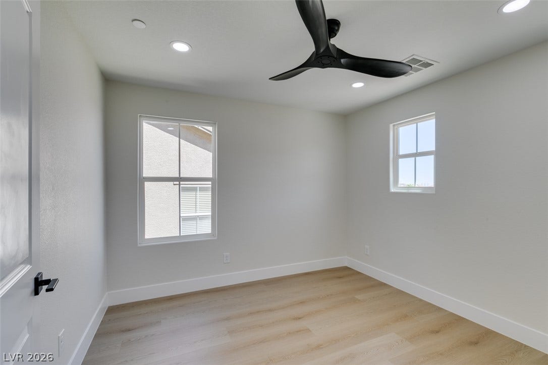197 Sicily Hills Court, Henderson, NV 89012 Recessed lighting and warm wood flooring define this versatile secondary space.