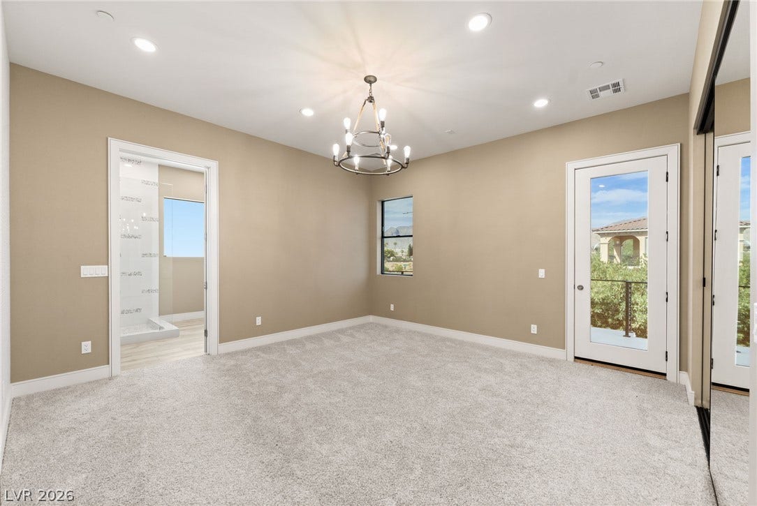 Plush carpeting and recessed lighting create a comfortable sanctuary with access to the outdoors.