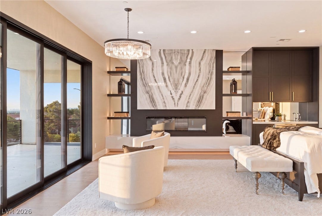 Sliding glass doors open to a private balcony from this spacious bedroom suite.