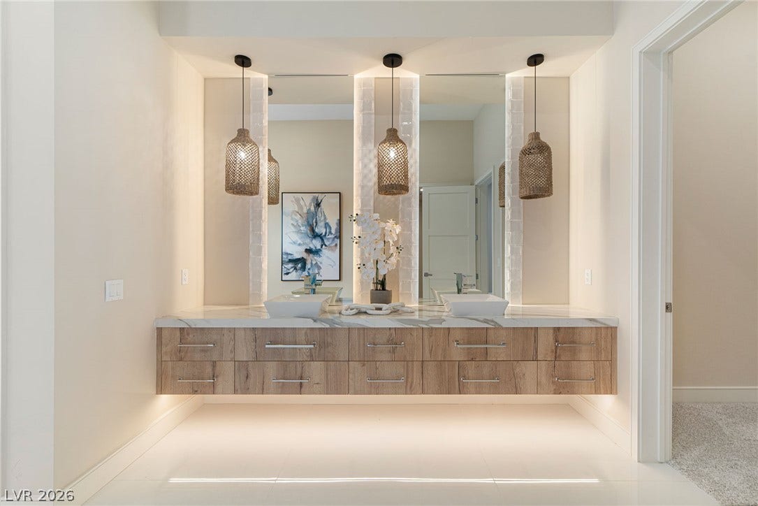 Clean lines and a floating wood vanity define this modern bathroom design.