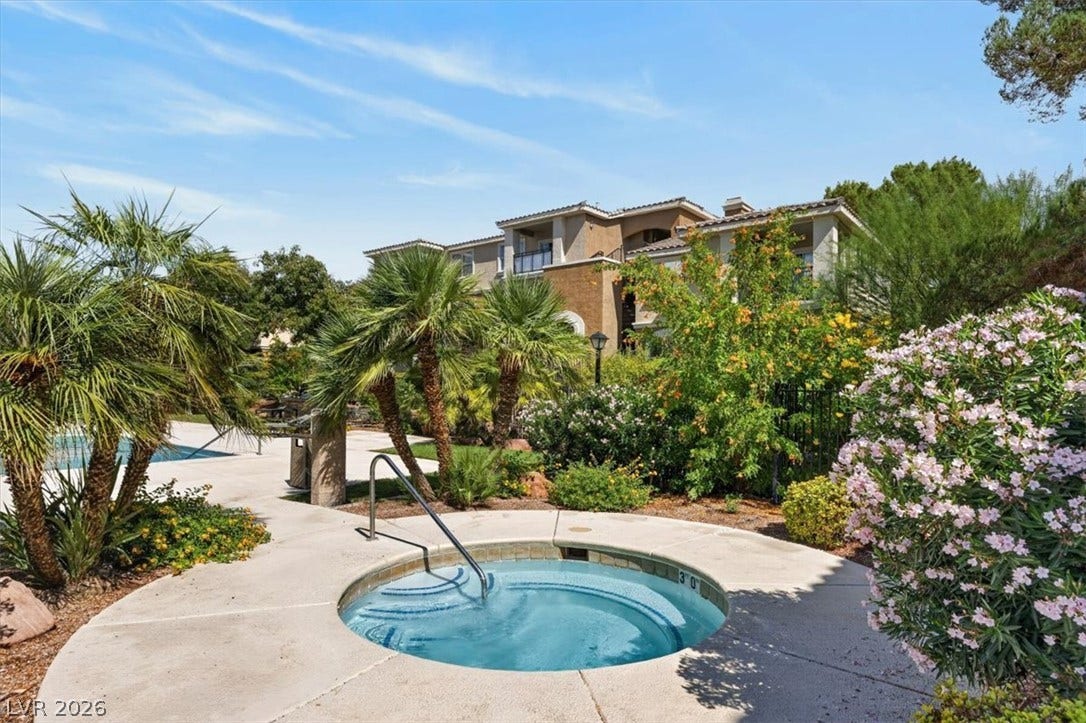 2900 Sunridge Heights Parkway, #1022, Henderson, NV 89052 An inviting in-ground spa sits nestled amid lush tropical landscaping and mature trees.