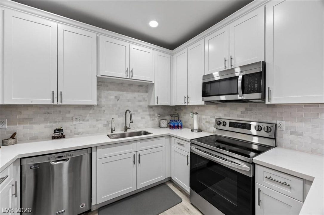 2900 Sunridge Heights Parkway, #1022, Henderson, NV 89052 Sleek modern cabinetry and stone counters define this beautifully updated kitchen.
