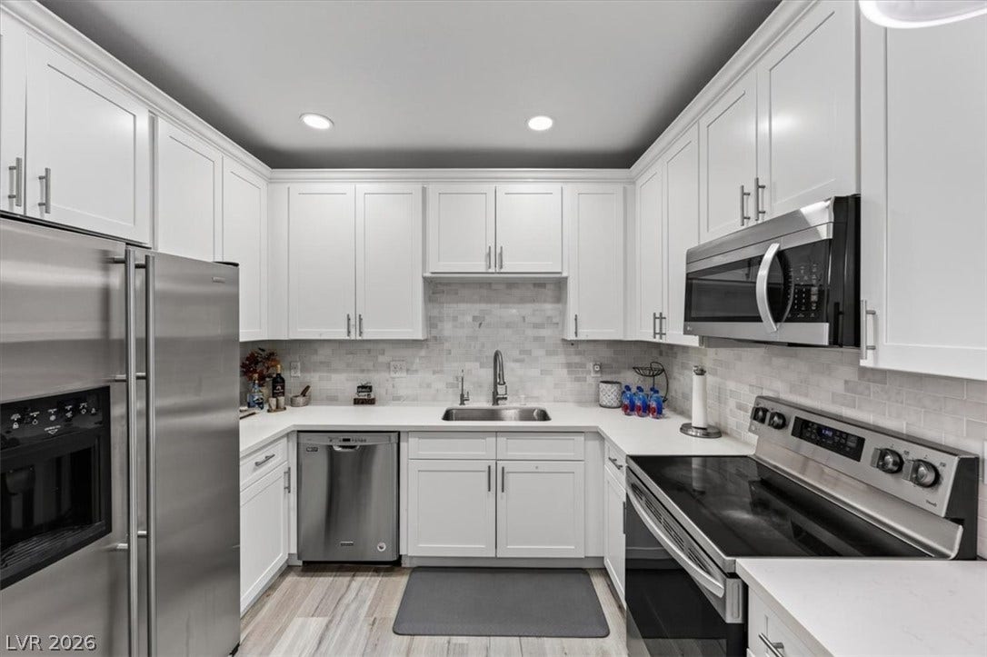 2900 Sunridge Heights Parkway, #1022, Henderson, NV 89052 Gleaming stainless steel appliances complement classic shaker cabinetry in this modern kitchen design.