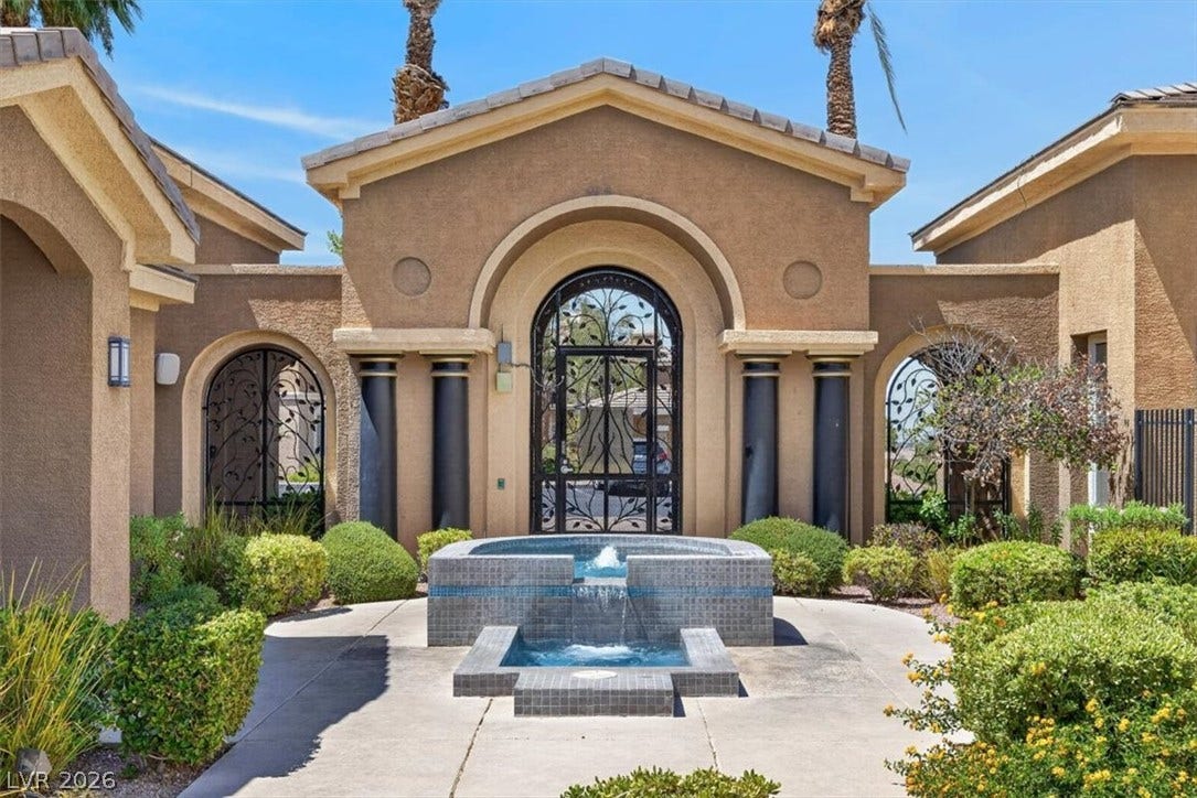 2900 Sunridge Heights Parkway, #1022, Henderson, NV 89052 A tiled water fountain anchors the grand entry courtyard of this desert estate.