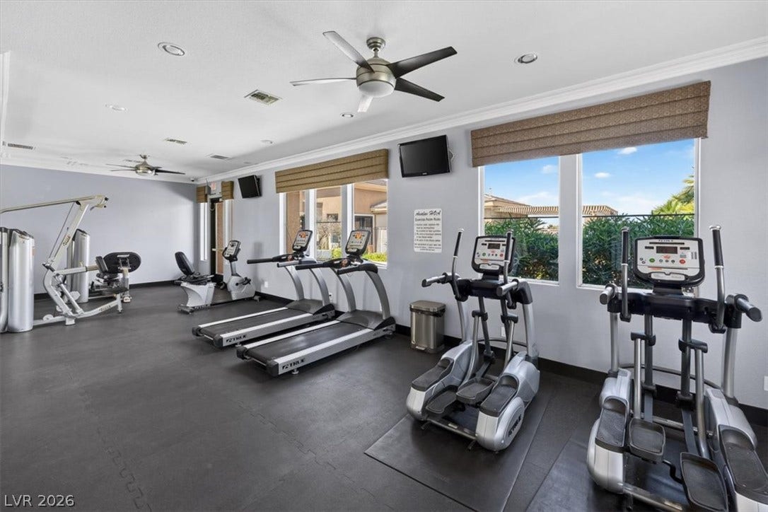 2900 Sunridge Heights Parkway, #1022, Henderson, NV 89052 Crown molding and recessed lighting elevate this fully equipped fitness space.