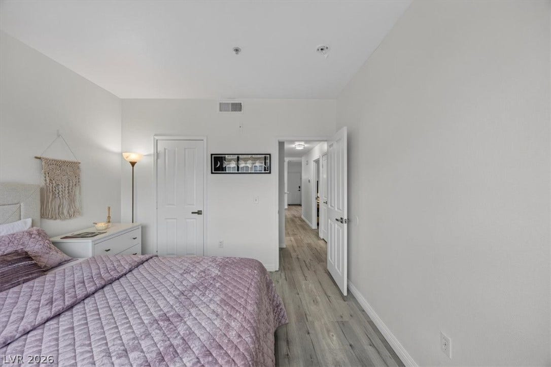 2900 Sunridge Heights Parkway, #1022, Henderson, NV 89052 Smooth wood-look flooring and crisp white walls create a serene, neutral retreat.