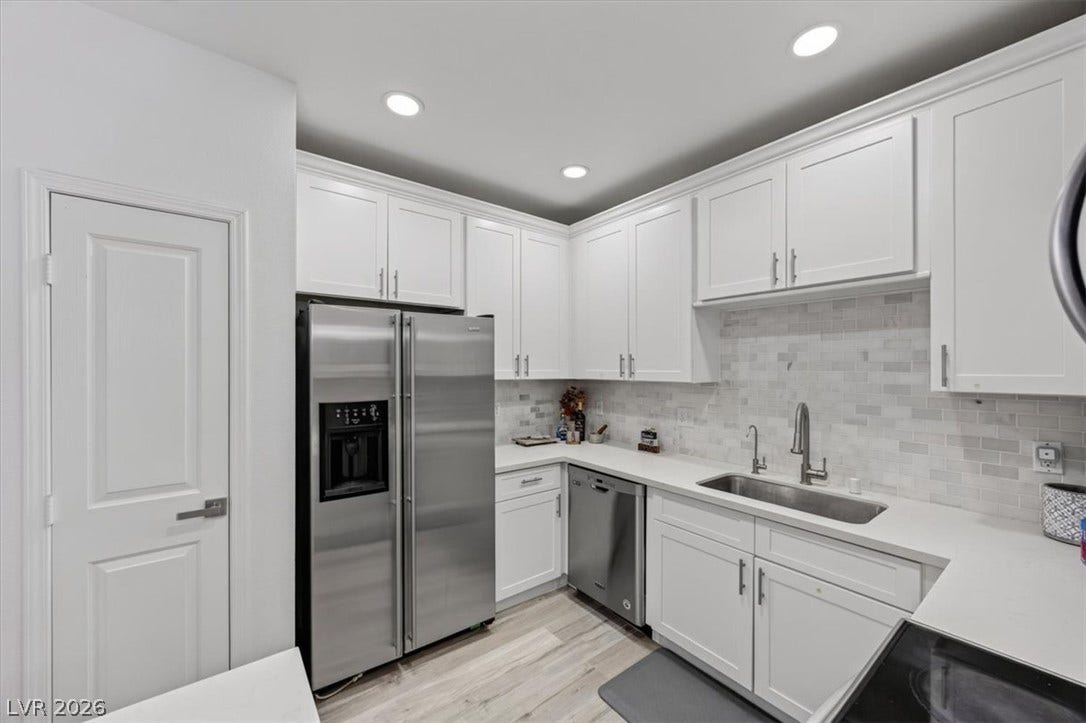 2900 Sunridge Heights Parkway, #1022, Henderson, NV 89052 Streamlined cabinetry and sleek stainless steel appliances anchor this modern workspace.