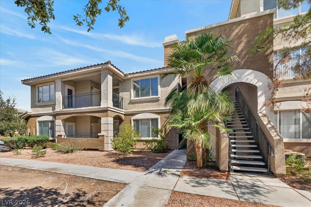2900 Sunridge Heights Parkway, #1022, Henderson, NV 89052 Mediterranean architectural styling highlights the exterior featuring integrated private balconies and arched walkways.