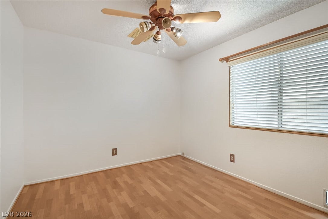 749 Tenderfoot Circle, Henderson, NV 89014 Smooth wood floors and a large window define this versatile space.