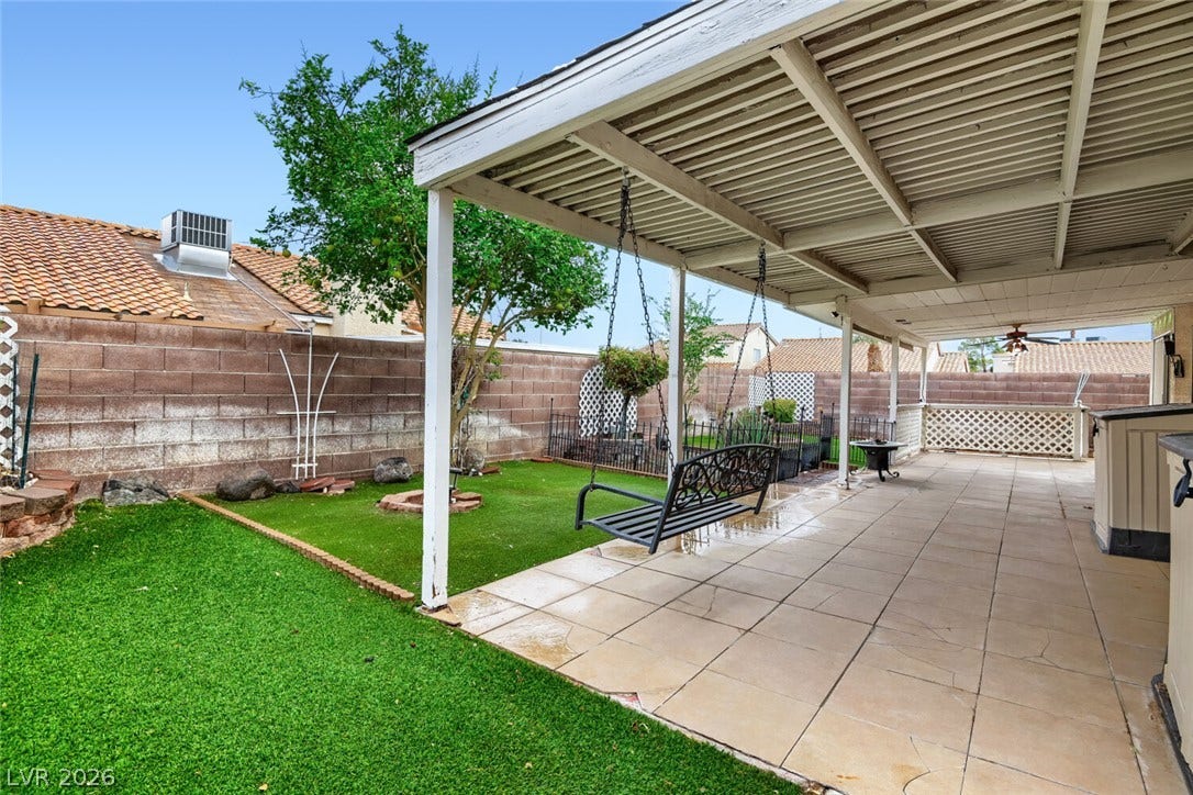 749 Tenderfoot Circle, Henderson, NV 89014 A spacious covered patio overlooks the private backyard with low-maintenance turf.