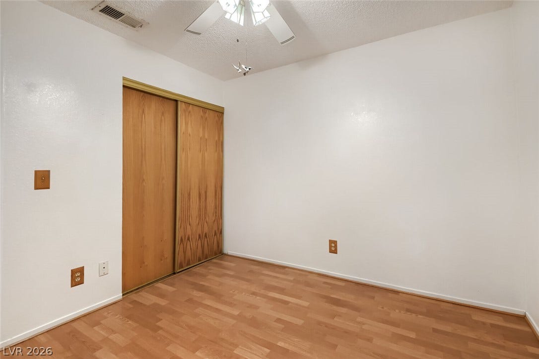 749 Tenderfoot Circle, Henderson, NV 89014 Warm wood floors and smooth walls create a clean foundation in this versatile room.