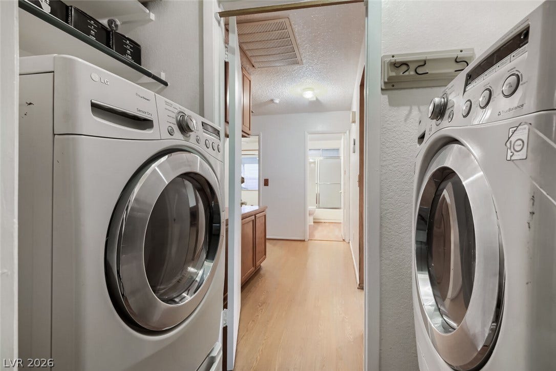 749 Tenderfoot Circle, Henderson, NV 89014 A dedicated utility space features built-in storage shelving and efficient side-by-side laundry appliances.