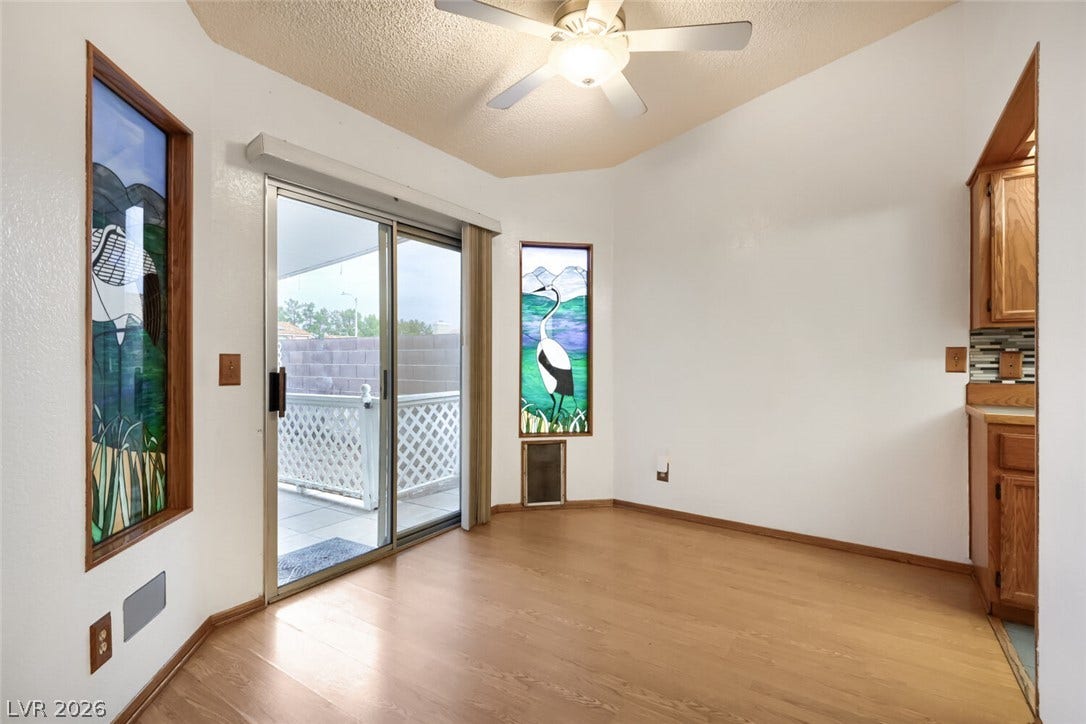 749 Tenderfoot Circle, Henderson, NV 89014 Sliding glass doors open to the outdoors from this inviting dining space with wood flooring.