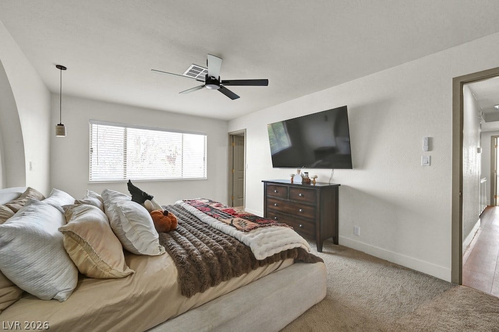 314 Encima Court, Henderson, NV 89014 Plush carpeting and abundant natural light create a welcoming and cozy bedroom atmosphere.