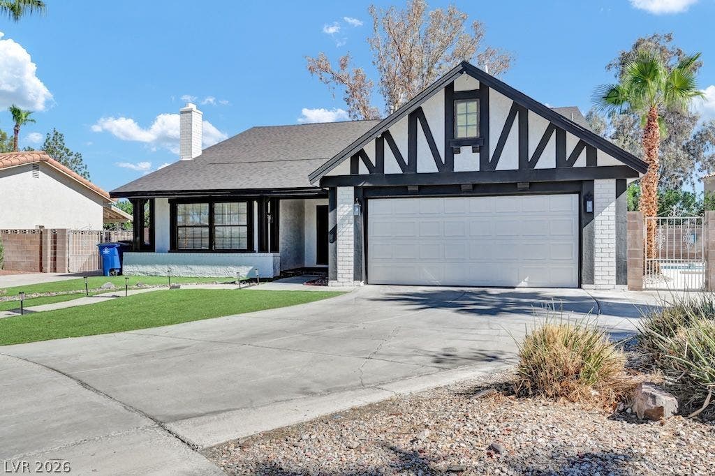 314 Encima Court, Henderson, NV 89014 Striking Tudor-inspired details and a broad driveway define this welcoming single-level home.