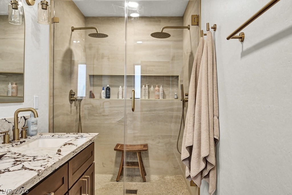 314 Encima Court, Henderson, NV 89014 Premium marble counters and dual showerheads elevate this elegant primary bath space.