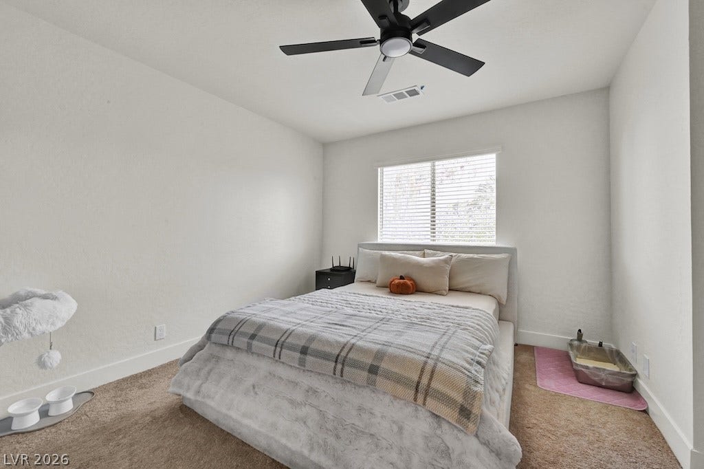 314 Encima Court, Henderson, NV 89014 Plush carpeting and a wide window create a comfortable, inviting atmosphere.