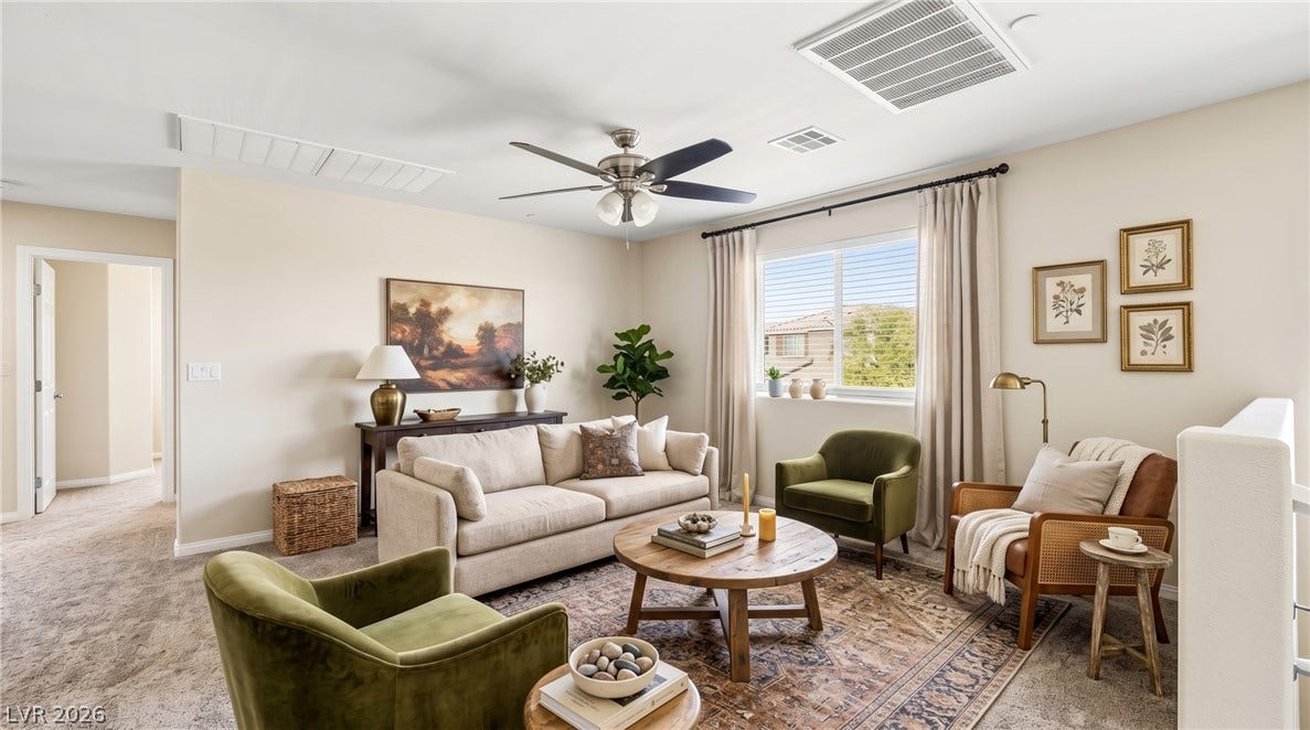 2221 Mundare Drive, Henderson, NV 89002 An inviting upper-level loft features wall-to-wall carpeting and a wide window overlooking the neighborhood.