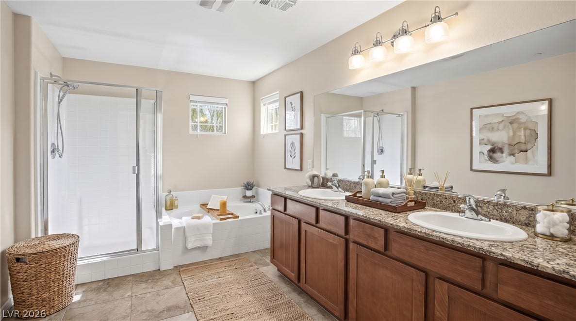 2221 Mundare Drive, Henderson, NV 89002 A spacious vanity with dual sinks anchors this well-appointed bathroom alongside a separate shower.