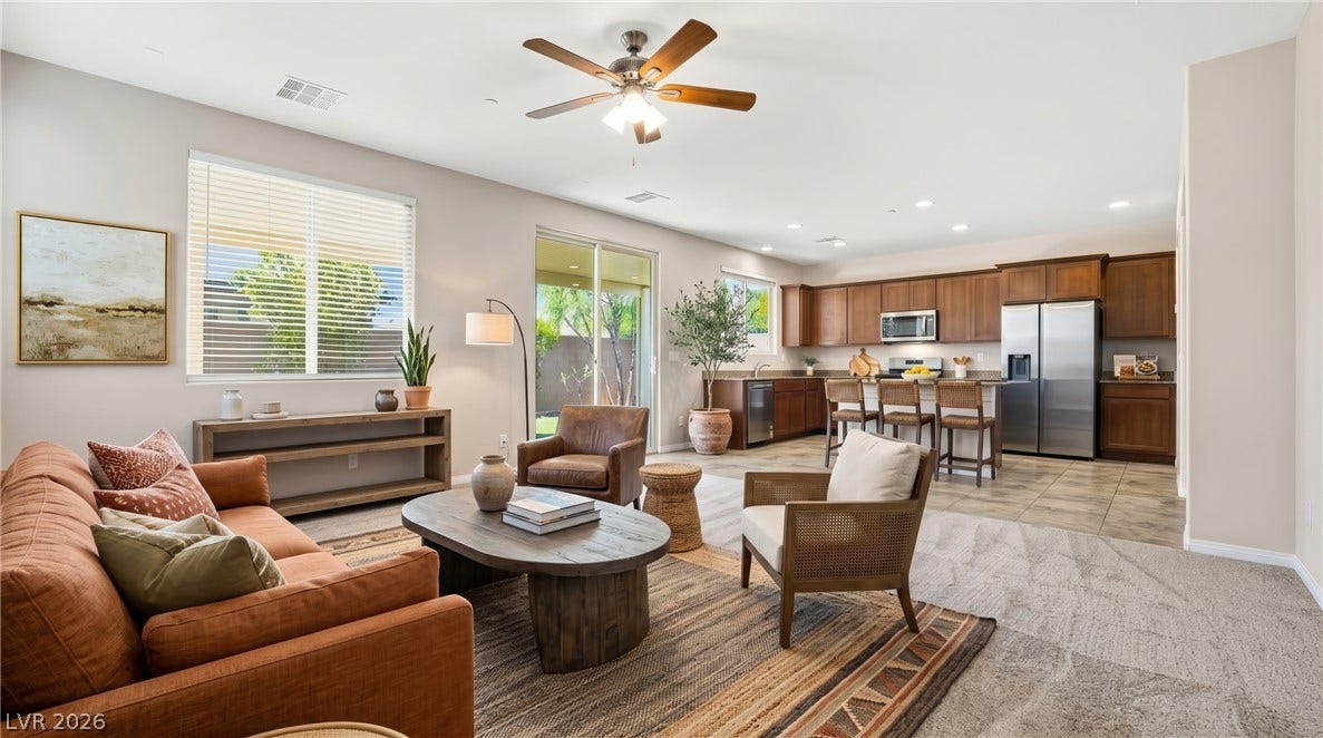 2221 Mundare Drive, Henderson, NV 89002 An open floorplan seamlessly connects the comfortable living area directly to the kitchen.