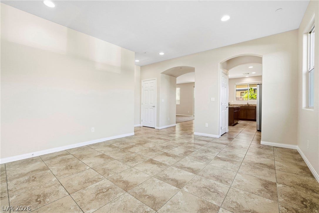 2221 Mundare Drive, Henderson, NV 89002 Polished tile flooring and arched doorways define this versatile interior space.