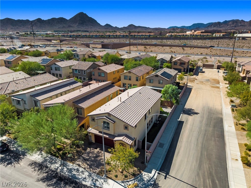 2221 Mundare Drive, Henderson, NV 89002 Striking desert mountains form a dramatic backdrop for this modern suburban neighborhood.