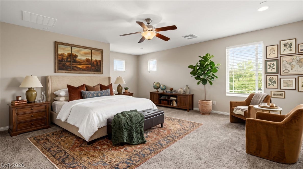 2221 Mundare Drive, Henderson, NV 89002 Generous windows invite abundant natural light into this spacious and comfortable bedroom.