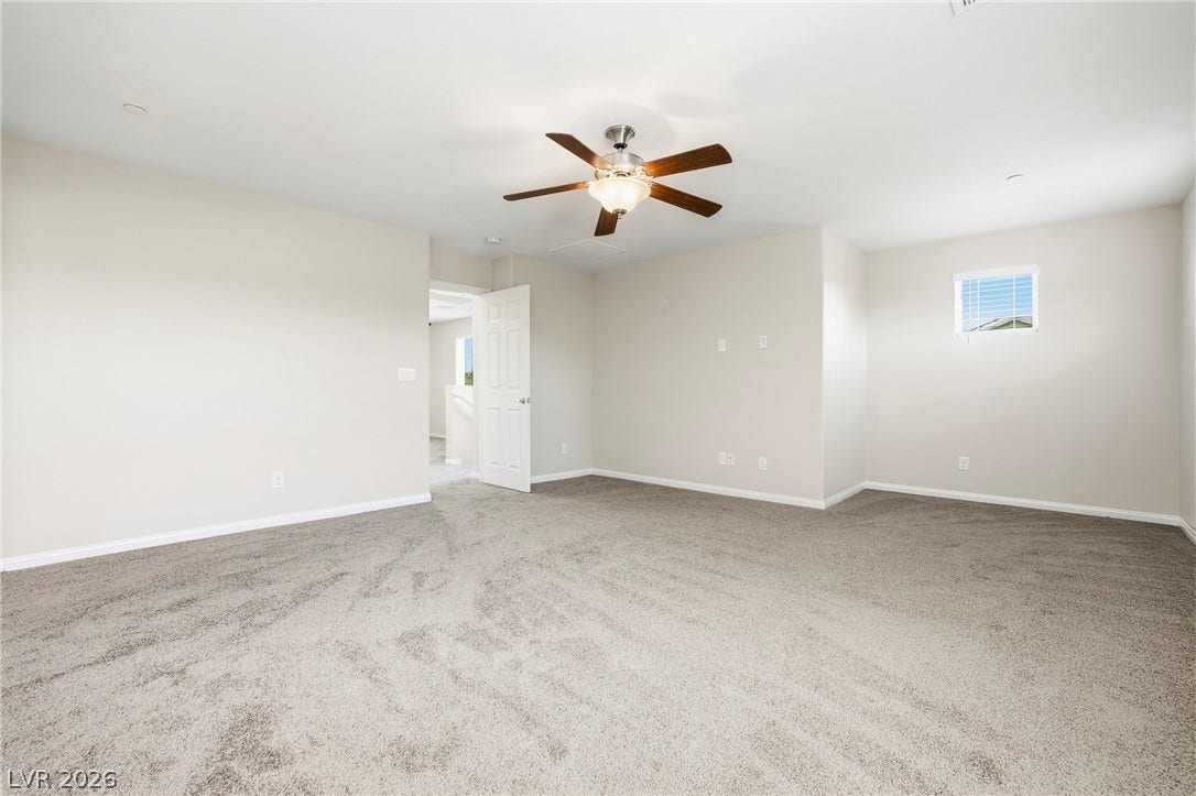 2221 Mundare Drive, Henderson, NV 89002 Plush carpeting and an open layout create a comfortable, flexible living space.