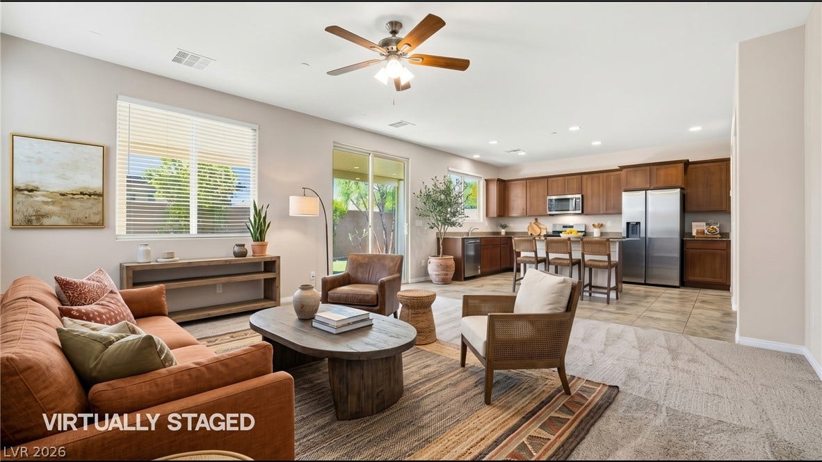2221 Mundare Drive, Henderson, NV 89002 An open floorplan seamlessly connects the comfortable living area directly to the kitchen.