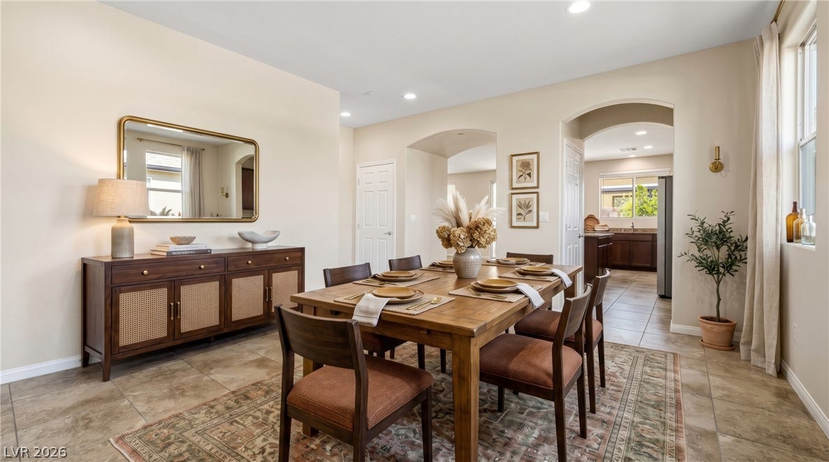 2221 Mundare Drive, Henderson, NV 89002 Arched doorways connect a formal dining space seamlessly to the adjacent kitchen.