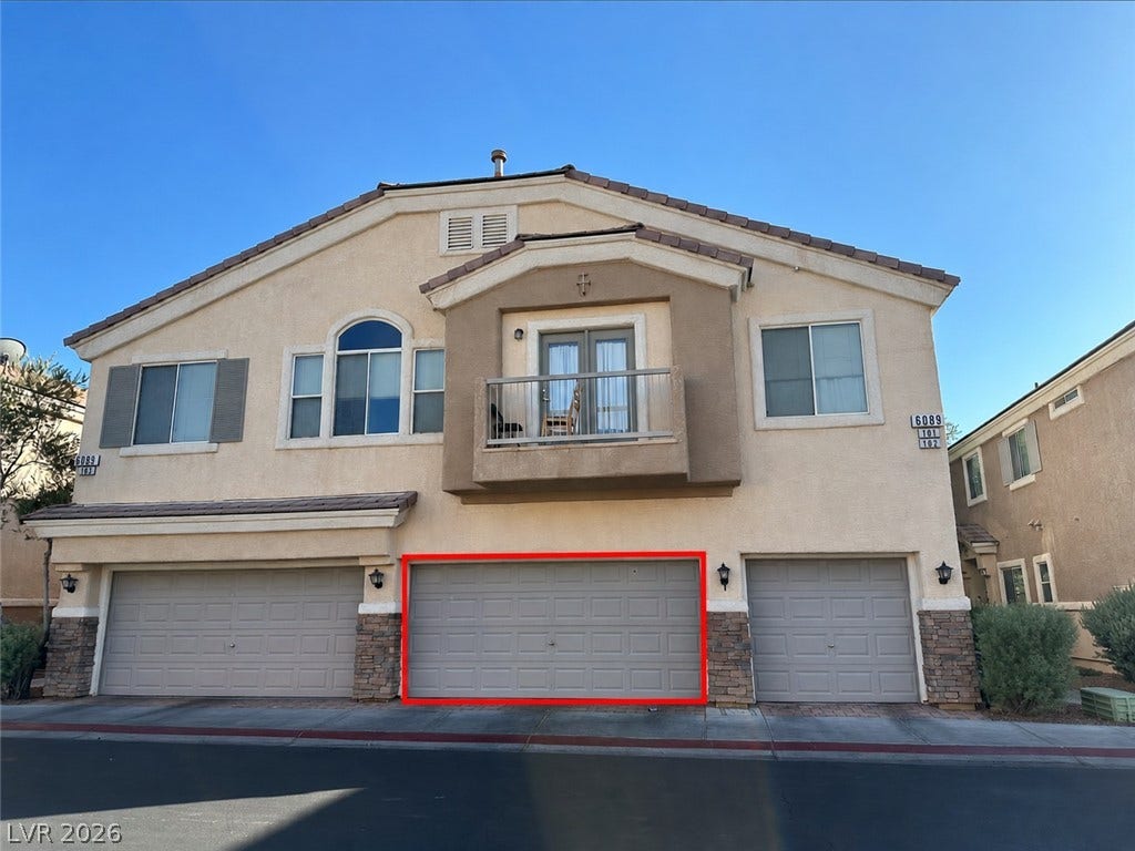 6089 Mustang Breeze Trail, #102, Henderson, NV 89011 Stucco exterior walls paired with stone accents define this multi-level residential design.