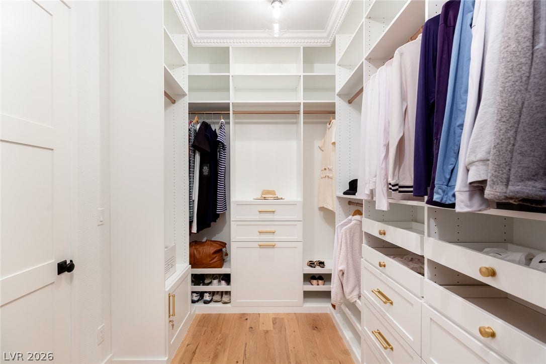 8 Pine Hollow Drive, Henderson, NV 89052 Custom built-ins in this elegant walk-in closet.