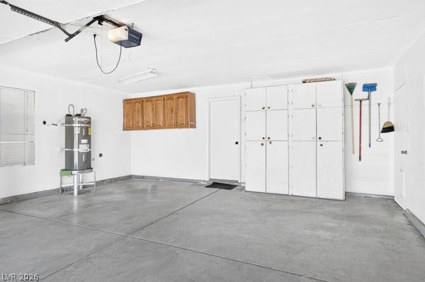 4284 Annie Oakley Drive, Las Vegas, NV 89121 Ample built-in storage cabinets line the walls of this clean concrete floor garage.