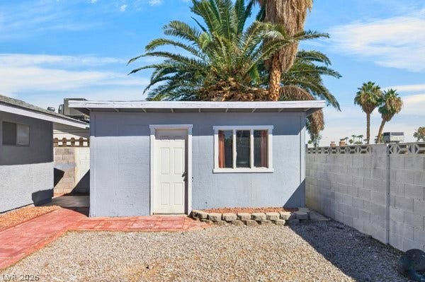 4284 Annie Oakley Drive, Las Vegas, NV 89121 A detached accessory building stands ready for use within a secure, fenced yard.