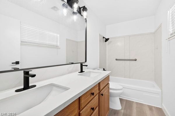 4284 Annie Oakley Drive, Las Vegas, NV 89121 Double vanities with matte black fixtures highlight this clean, modern bathroom with a tub-shower combination.