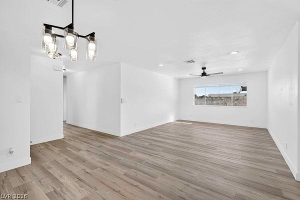4284 Annie Oakley Drive, Las Vegas, NV 89121 An open floor plan connects versatile living zones lined with updated plank flooring.