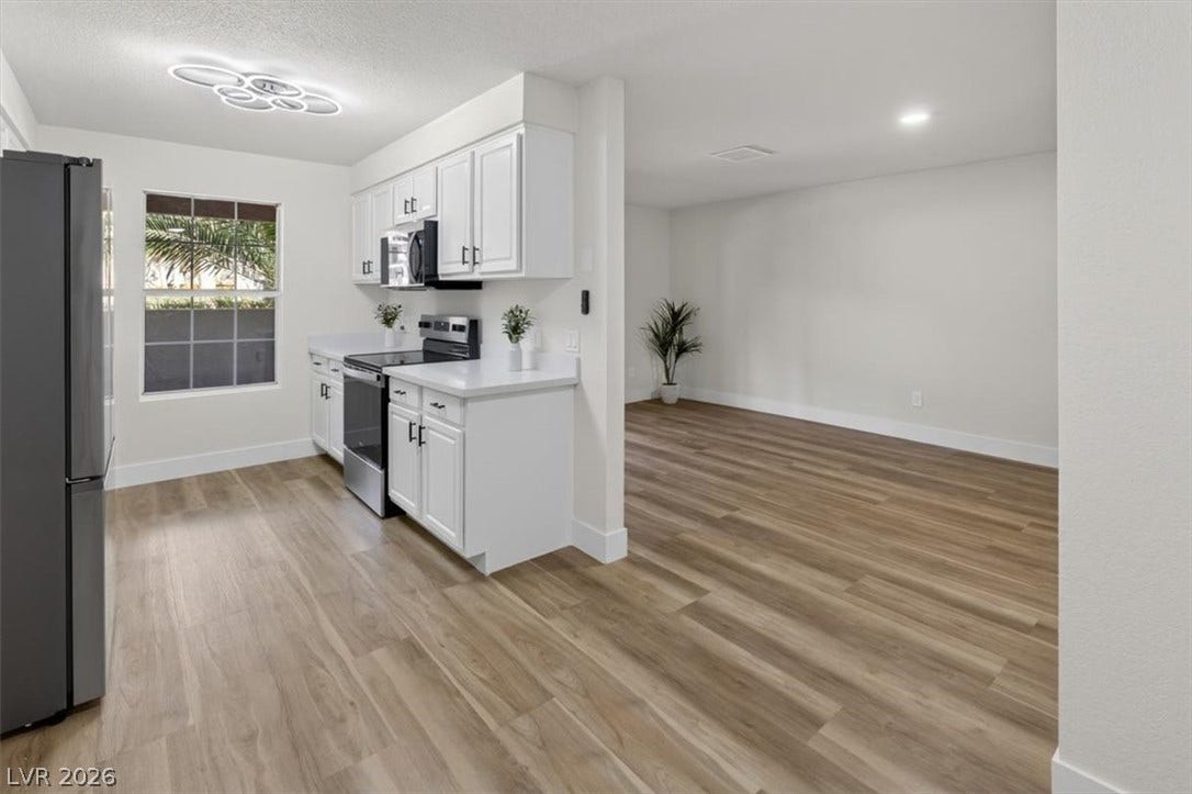 2606 S Durango Drive, #128, Las Vegas, NV 89117 An open layout connects the clean-lined kitchen directly to an adjacent living space.