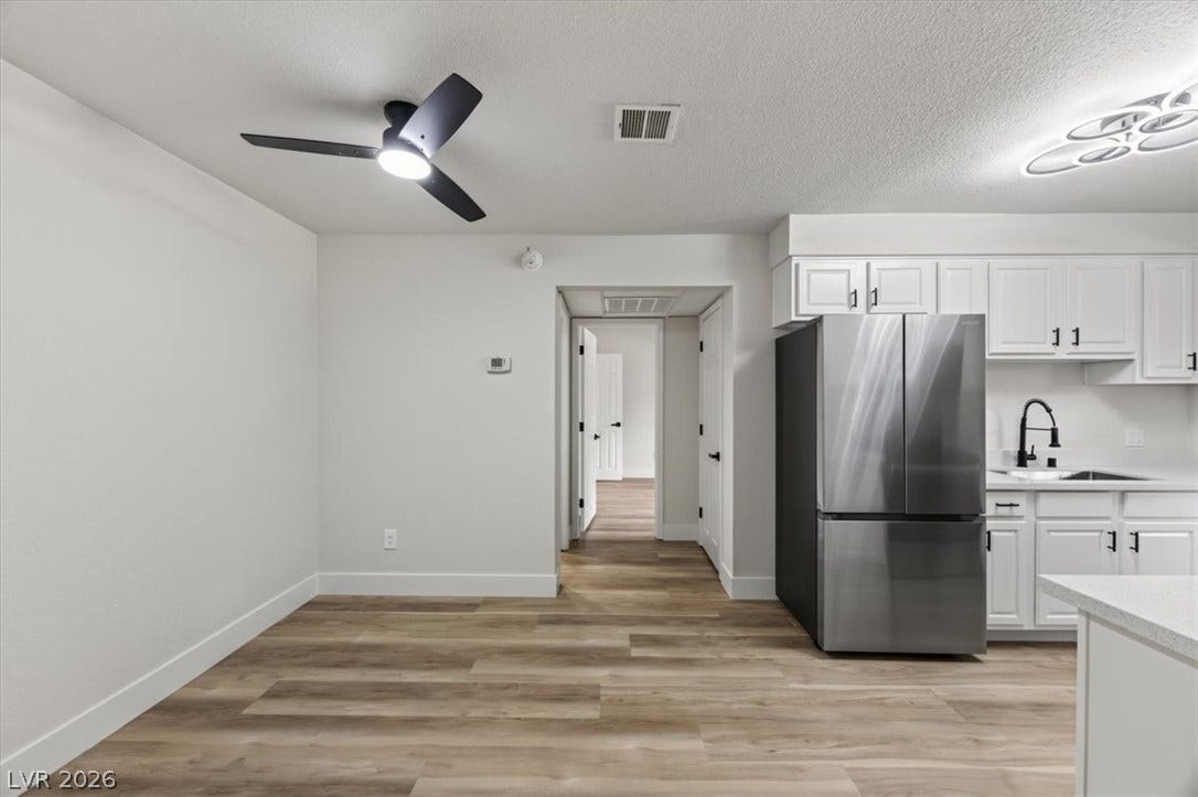 2606 S Durango Drive, #128, Las Vegas, NV 89117 Clean lines and durable plank flooring define this updated open-concept space.