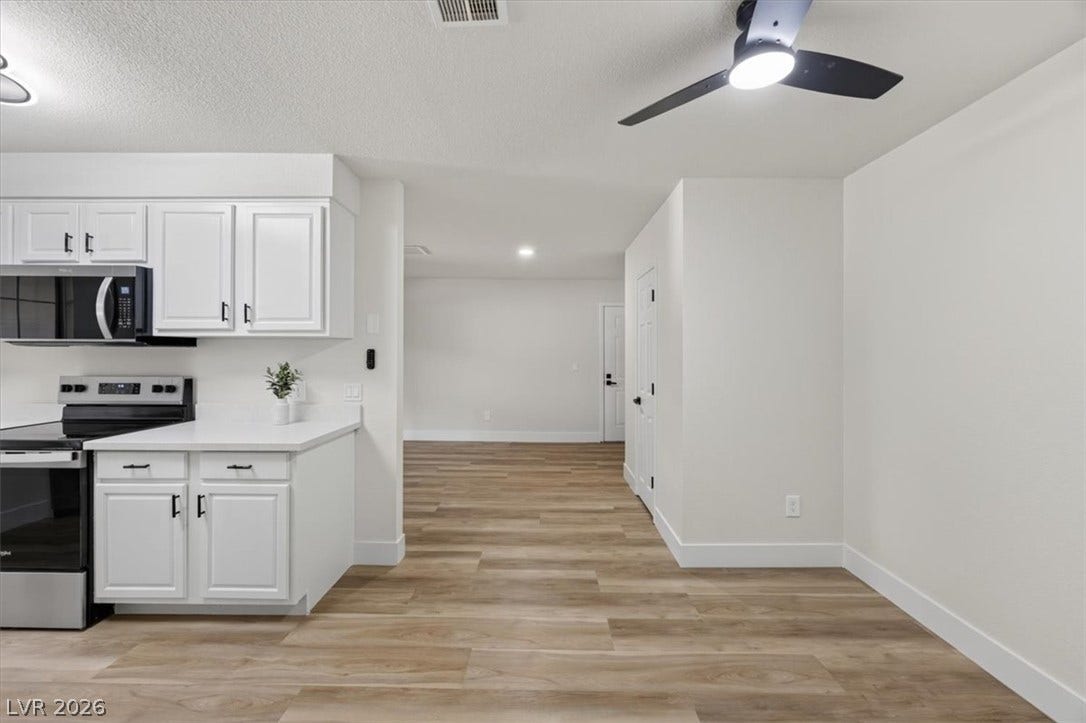 2606 S Durango Drive, #128, Las Vegas, NV 89117 An open floorplan seamlessly connects the functional kitchen area to the adjoining living spaces.