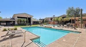 2606 S Durango Drive, #128, Las Vegas, NV 89117 An inviting swimming pool serves as the centerpiece of this beautifully landscaped outdoor recreation area.