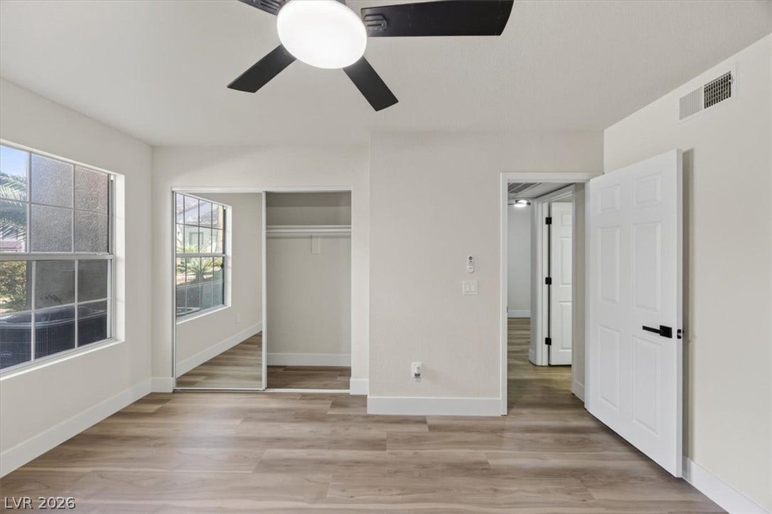 2606 S Durango Drive, #128, Las Vegas, NV 89117 Modern plank flooring and a mirrored closet define this serene space.