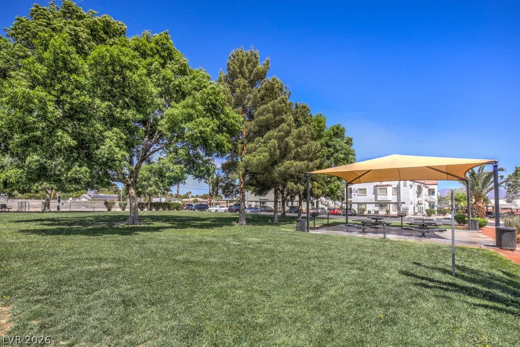 3318 N Decatur Boulevard, #2142, Las Vegas, NV 89130 Mature shade trees and a sheltered picnic area sit beside an expansive green lawn.