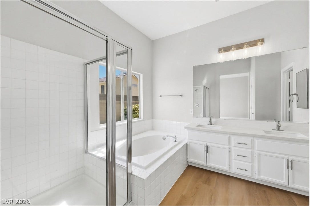 1906 Cardinal Point Street, Henderson, NV 89012 Clean lines and a spacious dual vanity define this modern bathroom.