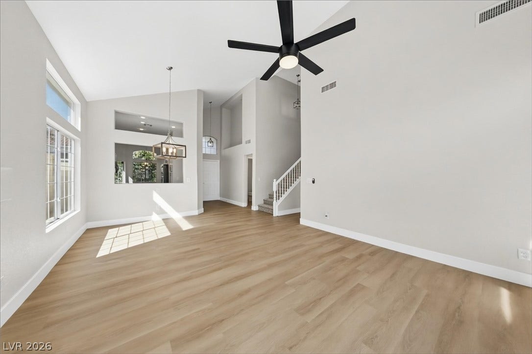 1906 Cardinal Point Street, Henderson, NV 89012 Gleaming wood floors pair with high vaulted ceilings in this open, airy layout.