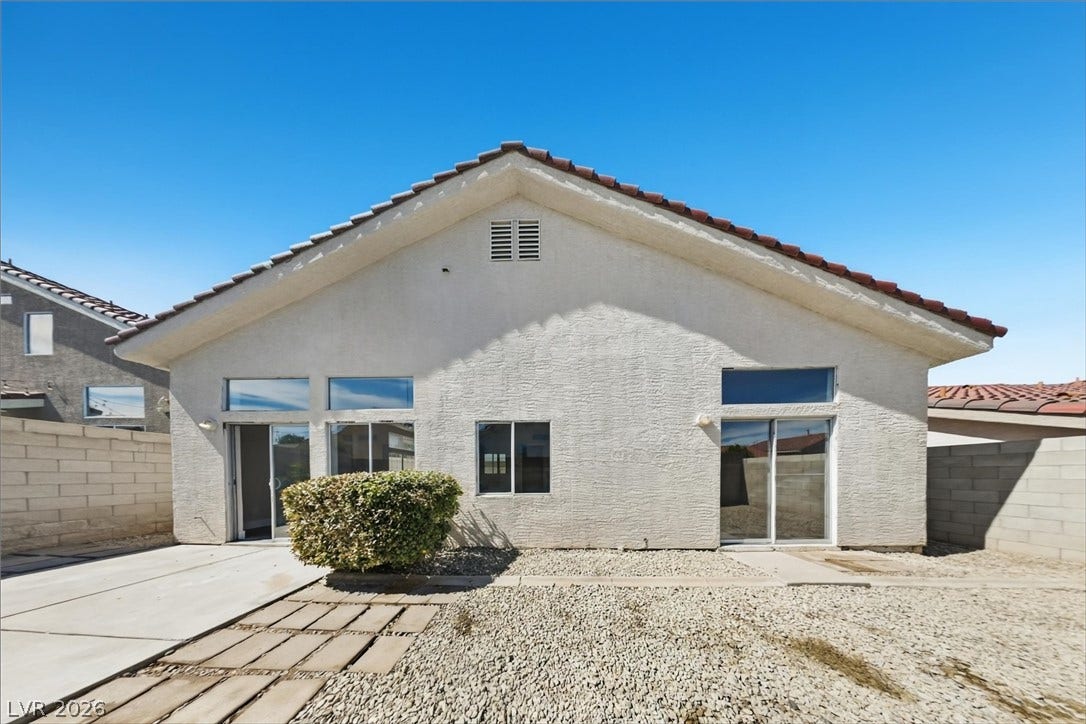 1906 Cardinal Point Street, Henderson, NV 89012 A stucco exterior with a classic tile roof overlooks a low-maintenance yard.