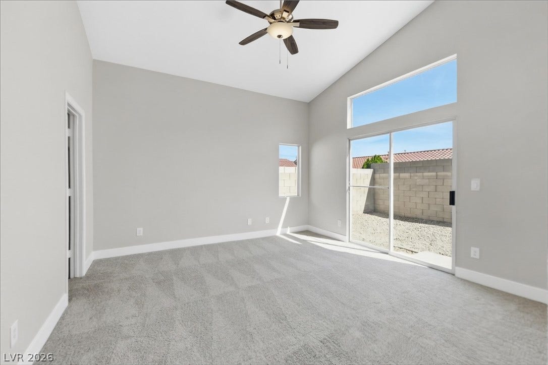 1906 Cardinal Point Street, Henderson, NV 89012 Vaulted ceilings and plush carpeting elevate this airy space, which connects directly to the outdoors.